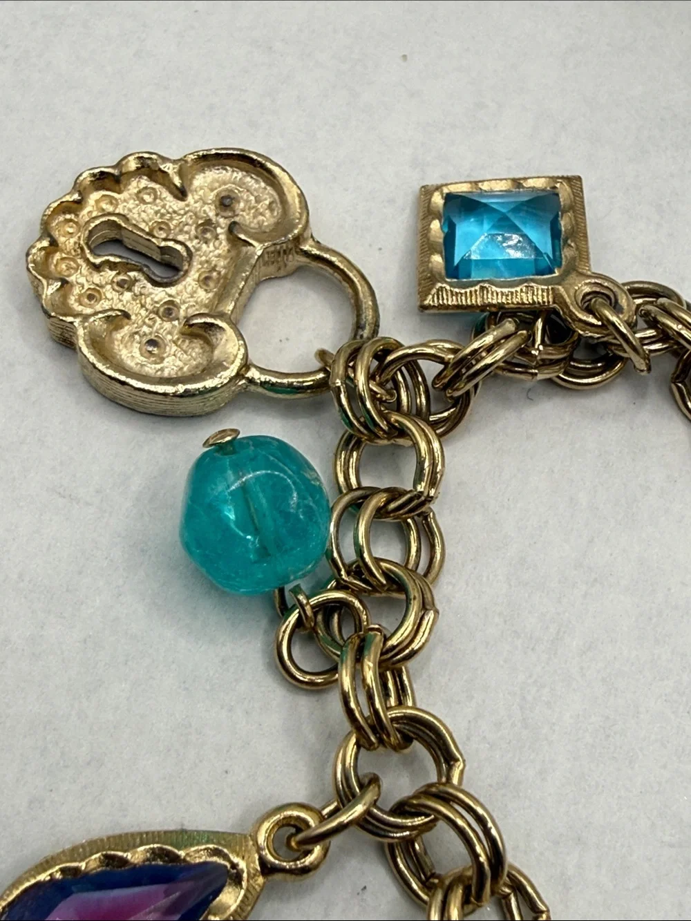 Whimsy Gold-Tone Charm Bracelet with Aqua Beads and Purple Teardrops lock & key